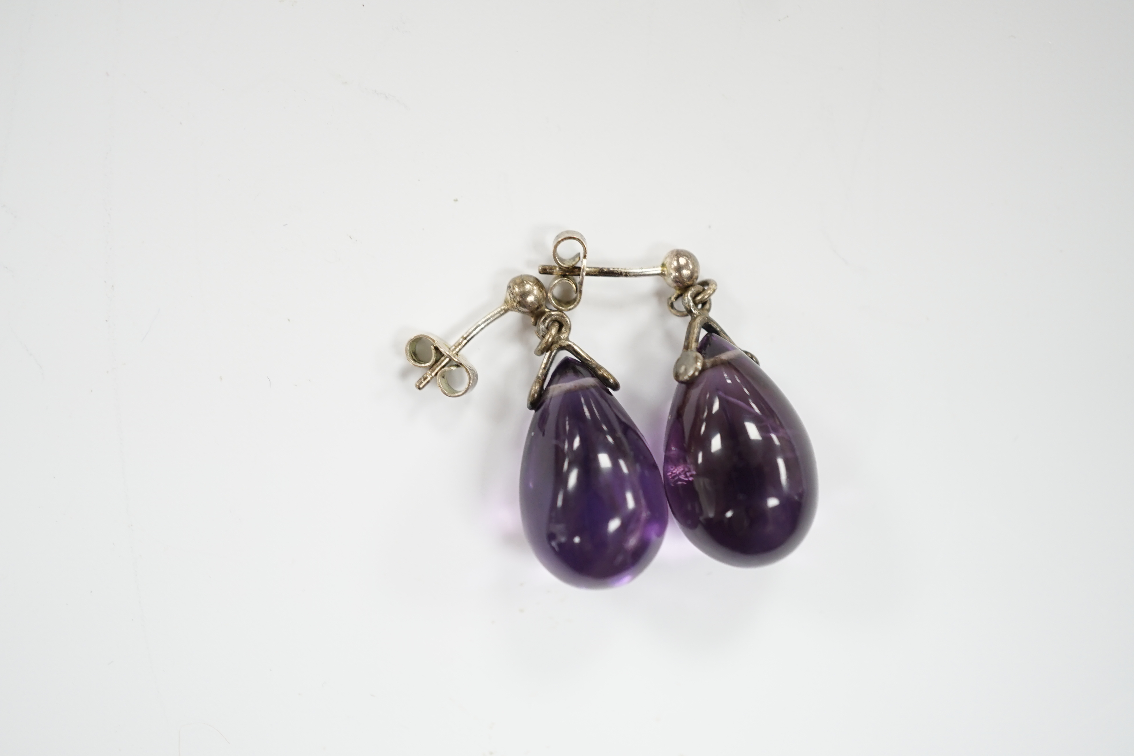 A pair of white metal and pear shaped amethyst drop earrings, 18mm.
